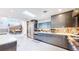 Bright kitchen featuring modern grey cabinetry, stainless steel appliances, and a skylight at 463 Locust St, Denver, CO 80220