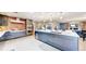 Spacious kitchen with an island, stainless steel appliances, and modern gray cabinets at 463 Locust St, Denver, CO 80220