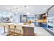 Sleek kitchen features a large island with seating, stainless appliances, and ample storage at 463 Locust St, Denver, CO 80220