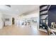 Upstairs landing with stainless steel railing, hardwood floors and custom shelving unit at 463 Locust St, Denver, CO 80220