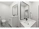 Stylish bathroom with modern fixtures, patterned tile floor, and framed mirrors at 11989 E Lake Cir, Greenwood Village, CO 80111