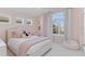 Bedroom featuring light pink walls, carpeted floor, a window and a bed at 11989 E Lake Cir, Greenwood Village, CO 80111