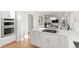 Open-concept kitchen with stainless steel appliances, white cabinets, and a view into the adjacent dining area at 11989 E Lake Cir, Greenwood Village, CO 80111