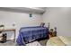 Cozy bedroom featuring a full bed, an industrial desk, and a comfortable lounge space at 4194 S Fraser Way # B, Aurora, CO 80014