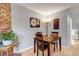Cozy dining room with hardwood floors and ample natural light, creating a welcoming atmosphere for Gathering meals and gatherings at 4194 S Fraser Way # B, Aurora, CO 80014