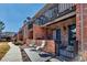A welcoming condo exterior showcases charming patio and balcony, great for relaxing at 4194 S Fraser Way # B, Aurora, CO 80014