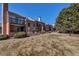Townhome exteriors with a well-maintained lawn, and balconies above the units at 4194 S Fraser Way # B, Aurora, CO 80014