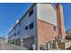 Attached garage with brick and siding exteriors at 4194 S Fraser Way # B, Aurora, CO 80014