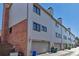 Attached garages with brick and siding exteriors at 4194 S Fraser Way # B, Aurora, CO 80014
