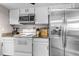 Modern kitchen with stainless steel appliances, granite countertops, and ample storage, perfect for culinary enthusiasts and Gathering meals at 4194 S Fraser Way # B, Aurora, CO 80014