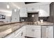 Modern kitchen with granite countertops, stainless steel appliances, and a convenient breakfast bar for casual dining and entertaining at 4194 S Fraser Way # B, Aurora, CO 80014