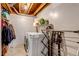 Functional laundry room featuring a washer and dryer, shelving, and laundry rack at 4194 S Fraser Way # B, Aurora, CO 80014