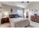 Serene main bedroom with soft lighting, and neutral tones, offering a relaxing retreat with an ensuite bathroom at 4194 S Fraser Way # B, Aurora, CO 80014