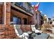 A cozy outdoor patio with comfortable seating, ideal for relaxing and enjoying the scenery at 4194 S Fraser Way # B, Aurora, CO 80014