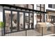 Inviting balcony with plush seating and large glass doors enhancing indoor-outdoor living at 13415 S Resort Dr, Conifer, CO 80433