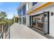 Exterior view of home's deck, showcasing floor-to-ceiling windows and an open-concept living space at 13415 S Resort Dr, Conifer, CO 80433