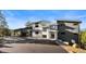 Gorgeous exterior showing contemporary home featuring modern design, large windows, and circular driveway at 13415 S Resort Dr, Conifer, CO 80433
