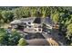 Stunning exterior of mountain home featuring a modern design, a spacious driveway and beautiful landscaping at 13415 S Resort Dr, Conifer, CO 80433