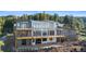 Lovely exterior showcasing a spacious two-story home with a large deck and expansive windows at 13415 S Resort Dr, Conifer, CO 80433