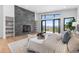 Comfortable main bedroom featuring fireplace, access to a private balcony, and scenic mountain views at 13415 S Resort Dr, Conifer, CO 80433