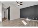 Spacious bedroom featuring hardwood floors, neutral paint, and a modern ceiling fan at 247 N Coolidge Way, Aurora, CO 80018