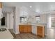 Well-lit kitchen featuring wood cabinets, white countertops, and stainless steel appliances at 247 N Coolidge Way, Aurora, CO 80018