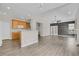 Open-concept living room with hardwood floors, neutral paint, and modern lighting fixtures at 247 N Coolidge Way, Aurora, CO 80018