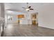 Open concept living room flows into the kitchen, featuring hardwood floors and recessed lighting at 247 N Coolidge Way, Aurora, CO 80018