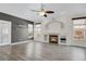 Spacious living room featuring hardwood floors, a cozy fireplace, and lots of natural light at 247 N Coolidge Way, Aurora, CO 80018