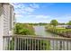 Balcony view of the lake with mature trees at 6861 Xavier Cir # 3, Westminster, CO 80030