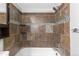 Stylish bathroom features unique tile design with complementary fixtures in neutral tones at 6861 Xavier Cir # 3, Westminster, CO 80030