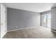 Neutral bedroom with plush carpet, sliding glass door and lots of natural light at 6861 Xavier Cir # 3, Westminster, CO 80030