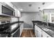 Updated kitchen featuring black granite countertops and stainless steel appliances at 6861 Xavier Cir # 3, Westminster, CO 80030