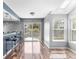 Open kitchen area with bar seating and natural light at 6861 Xavier Cir # 3, Westminster, CO 80030