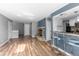 An open concept living space boasts hardwood floors and a charming fireplace at 6861 Xavier Cir # 3, Westminster, CO 80030