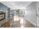 Bright living room boasts hardwood floors and a stone fireplace at 6861 Xavier Cir # 3, Westminster, CO 80030