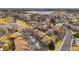 Birds eye view of multiple residential brown roofed houses with trees between the buildings at 2263 E 129Th Ave, Thornton, CO 80241