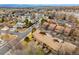 Panoramic aerial view of a residential neighborhood featuring tree-lined streets and mountain views at 2263 E 129Th Ave, Thornton, CO 80241