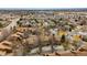Birds eye view of residential townhomes with a view of trees and bushes around the buildings at 2263 E 129Th Ave, Thornton, CO 80241