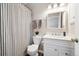 Bathroom features a walk-in shower, toilet, vanity and mirror at 2263 E 129Th Ave, Thornton, CO 80241