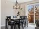 Dining room with a view to the outside, featuring a modern chandelier at 2263 E 129Th Ave, Thornton, CO 80241