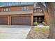 Inviting two-story townhouse featuring a private garage and a charming front entrance with beautiful wood siding at 2263 E 129Th Ave, Thornton, CO 80241