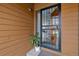 Close-up of the front door featuring decorative security door, lovely house plant, and views into the front entry at 2263 E 129Th Ave, Thornton, CO 80241