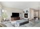 Cozy living room featuring wood floors, a fireplace, and neutral paint at 2263 E 129Th Ave, Thornton, CO 80241