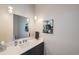Contemporary bathroom features a sleek vanity and modern sink with a turtle artwork for a unique touch at 4200 W 17Th Ave # 1013, Denver, CO 80204