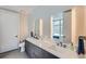 Elegant bathroom featuring double sinks, a sleek vanity, modern fixtures, and contemporary design at 4200 W 17Th Ave # 1013, Denver, CO 80204