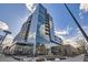 Modern building featuring a reflective glass exterior and unique architectural design at 4200 W 17Th Ave # 1013, Denver, CO 80204