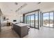 Bright kitchen featuring a large island, modern pendant lights and stunning city views at 4200 W 17Th Ave # 1013, Denver, CO 80204