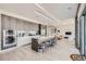 Contemporary kitchen with sleek cabinetry, marble backsplash, large island and stainless steel appliances at 4200 W 17Th Ave # 1013, Denver, CO 80204
