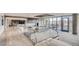 Upscale building lobby and seating area with fireplace, TV, and a clear view of the outdoors at 4200 W 17Th Ave # 1013, Denver, CO 80204